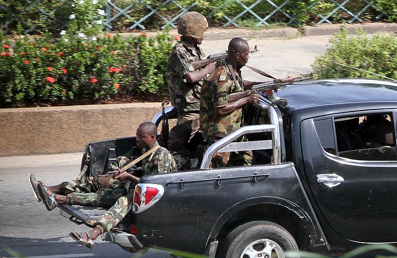 Soldiers loyal to Laurent Gbagbo patrol a street in Abidjan