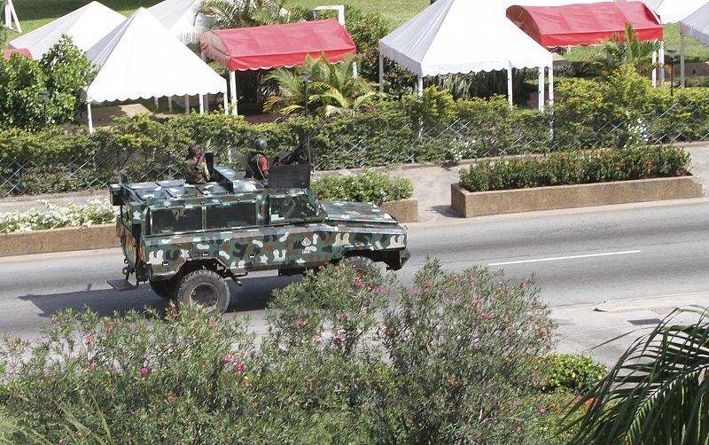 Soldiers loyal to Laurent Gbagbo patrol a street in Abidjan