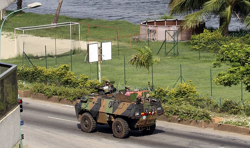 A French armoured vehicle patrols a street in Abidjan