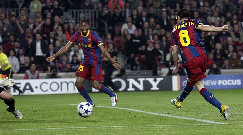 Iniesta scores a goal against Shakhtar Donetsk during their Champions League match at Camp Nou stadium in Barcelona
