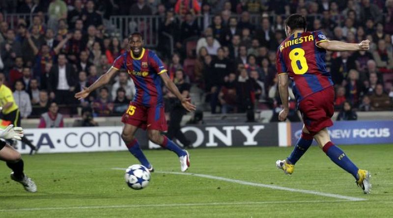 Iniesta scores a goal against Shakhtar Donetsk during their Champions League match at Camp Nou stadium in Barcelona