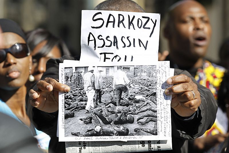 Pro- Gbagbo demonstrators protest in front of the National Assembly in Paris