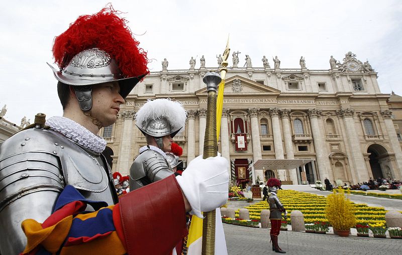 Swiss Guards stand to attention before the start of the Easter Mass led by Pope Benedict XVI in Saint Peter's Square at the Vatican