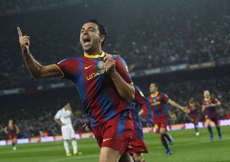 Barcelona's Xavi celebrates after scoring against Real Madrid during their Spanish first division soccer match in Barcelona