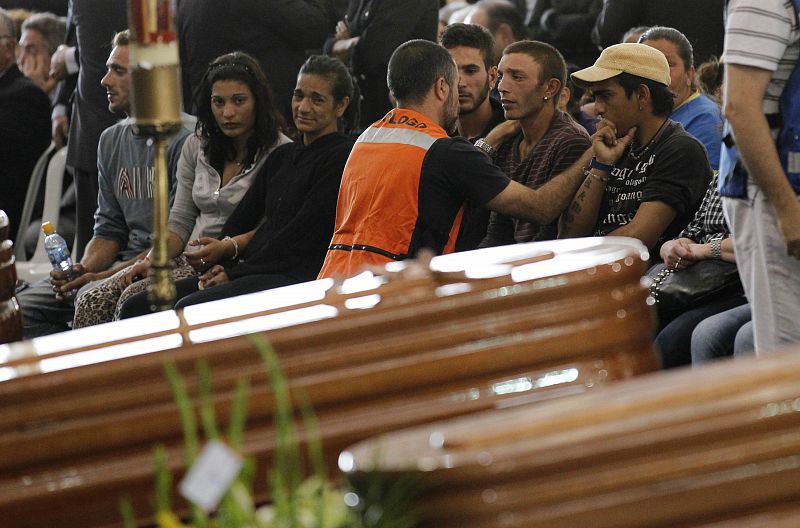 Family members of earthquake victims grieve at a funeral ceremony in Lorca