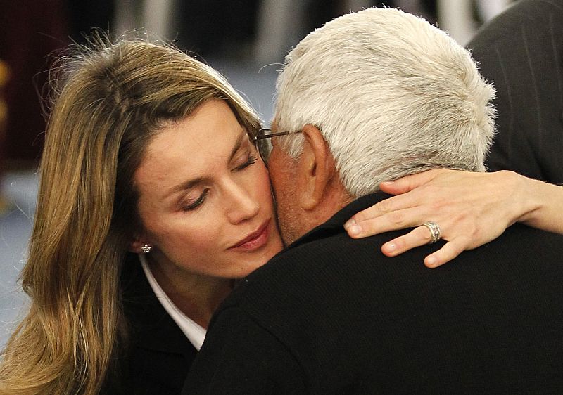 Princess Letizia embraces a family member of an earthquake victim at a funeral ceremony in Lorca