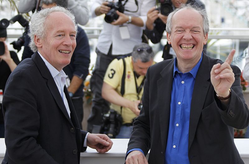 Directors Jean-Pierre and Luc Dardenne reacts during a photocall  for the film Le Gamin au velo" in competition at the 64th Cannes Film Festival