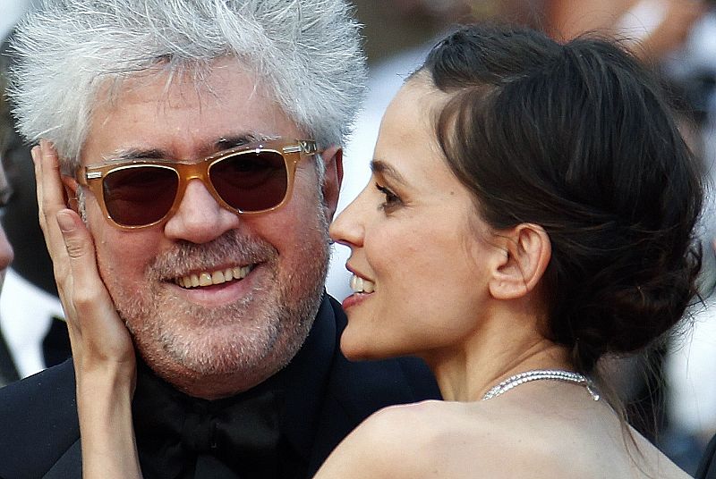 Director Almodovar poses with cast member Anaya as they arrive for the screening of their film La Piel Que Habito at the 64th Cannes Film Festival