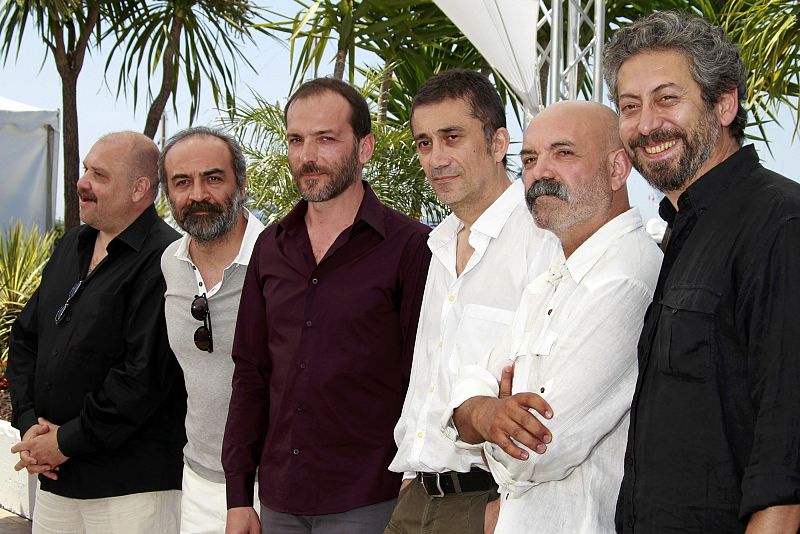 Director Nuri Bilge Ceylan poses with cast members during a photocall for the film Bir Zamanlar Anadolu'da at the 64th Cannes Film Festival