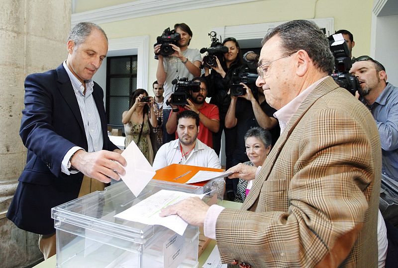 Valencia's Popular Party's regional candidate Camps casts his vote during regional and municipal elections in Valencia