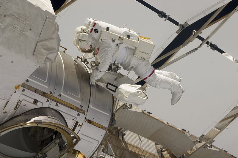 Space shuttle Endeavour astronaut Greg Chamitoff returns to the International Space Station's Qwest airlock after experiencing problems with his spacesuit