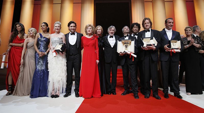 Jury President Robert de Niro poses with award winners during the closing ceremony of the 64th Cannes Film Festival