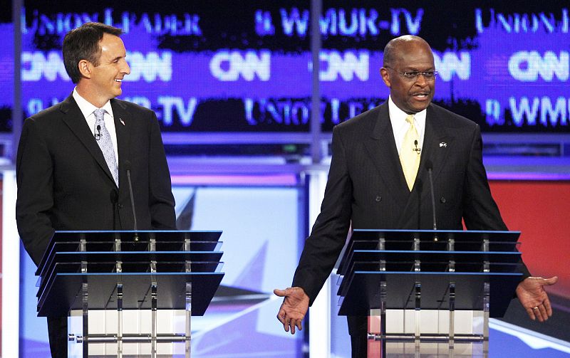 Tim Pawlenty y Herman Cain durante el encuentro de candidatos republicanos