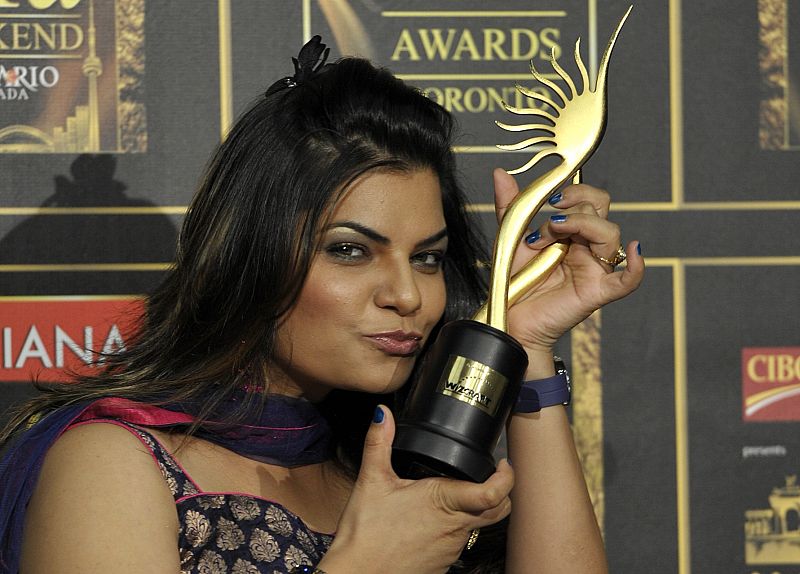 Singer Sharma holds her award for Best Playback Singer for her song Munni Badnam from the movie "Dabangg" during the International Indian Film Academy (IIFA) Awards in Toronto