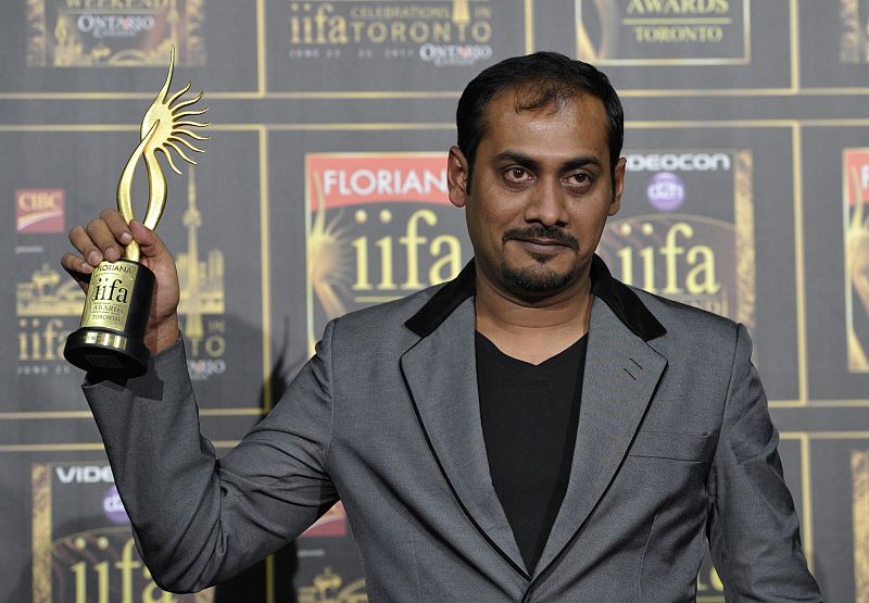 Abhinav Kashyap holds the award for best screenplay for "Dabangg" at the International Indian Film Academy (IIFA) Awards in Toronto