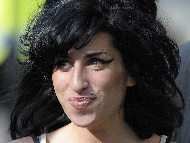 File photo of British singer Amy Winehouse arriving at the City of Westminster Magistrates Court in central London