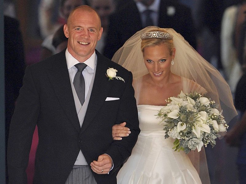 Britain's Zara Phillips and her husband Mike Tindall leave after their marriage at Canongate Kirk in Edinburgh