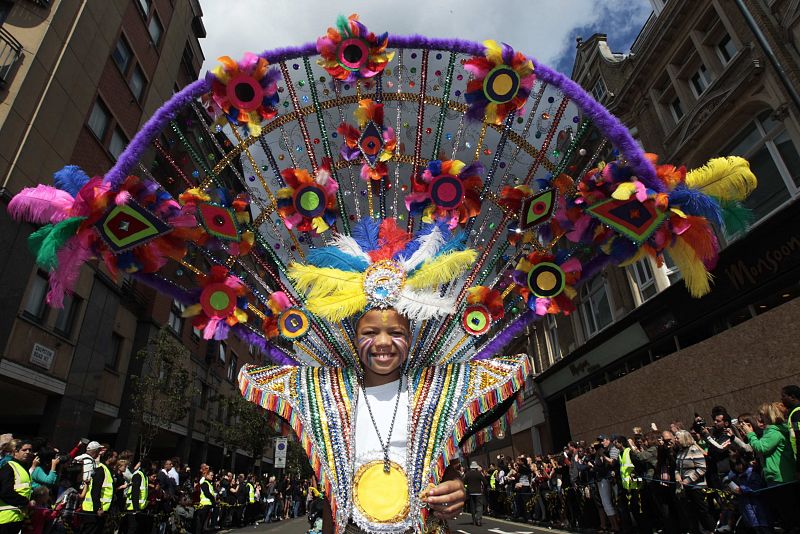 A performer dances in the street parade at the annual Notting Hill Carnival in central London