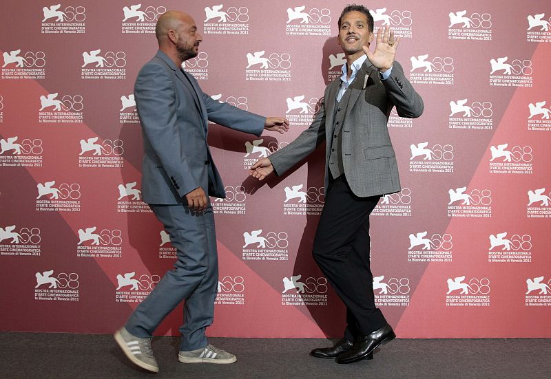 Actor Fiorello and director Crialese arrive to pose during a photocall for their film "Terraferma" at the 68th Venice Film Festival