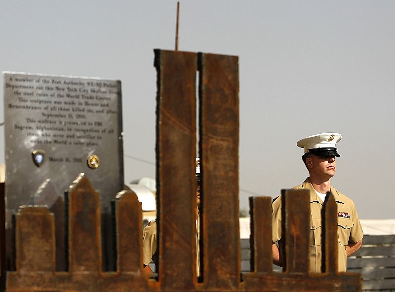 U.S. honor guard stands next to metallic model of World Trade Center during event to mark 10th anniversary of 9/11 attacks on World Trade Center in the United States, at U.S. embassy in Kabul