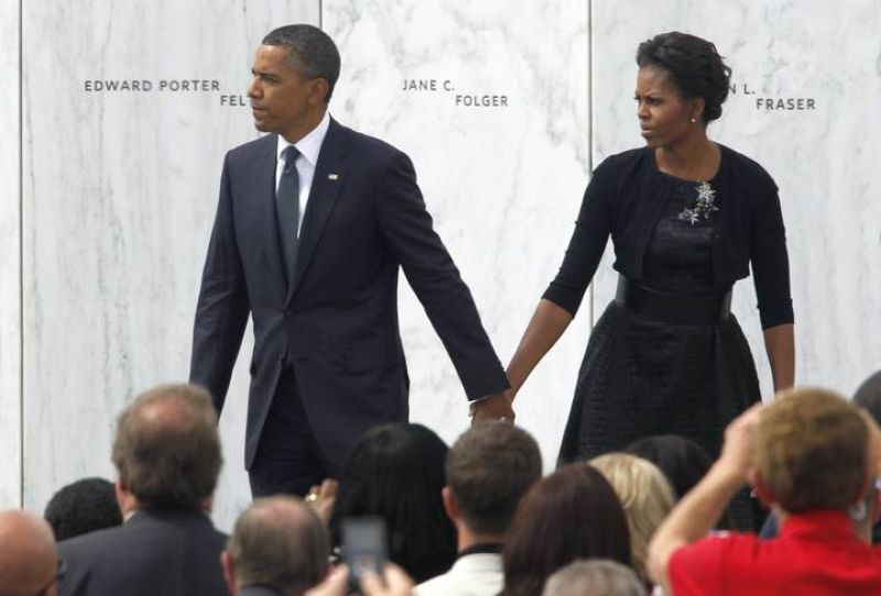 Obama and first lady, Michelle Obama walk along the memorial site for the victims of Flight 93 during ceremonies marking the 10th anniversary of the 9/11 attack in Shanksville, Pennsylvania