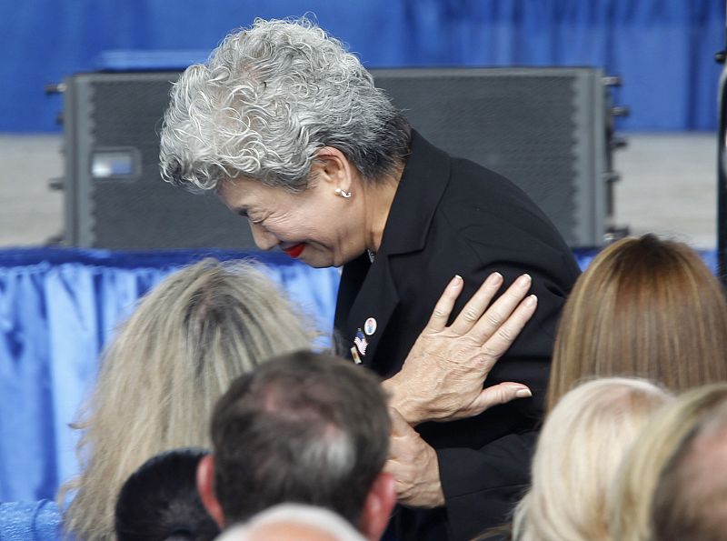 Yachiyo Kuge is comforted after giving a speech during ceremonies marking the 10th anniversary of the 9/11 attack in Shanksville, Pennsylvania