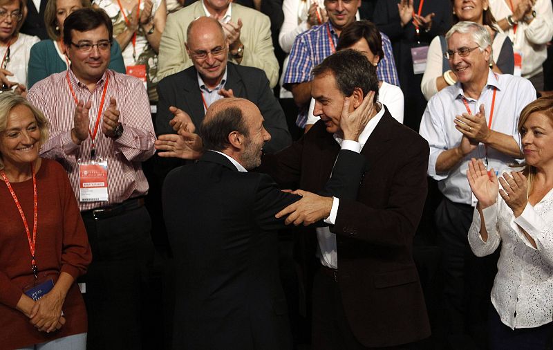 Spain's Socialist prime ministerial candidate Rubalcaba embraces Spanish PM Rodriguez Zapatero during the PSOE political conference in Madrid