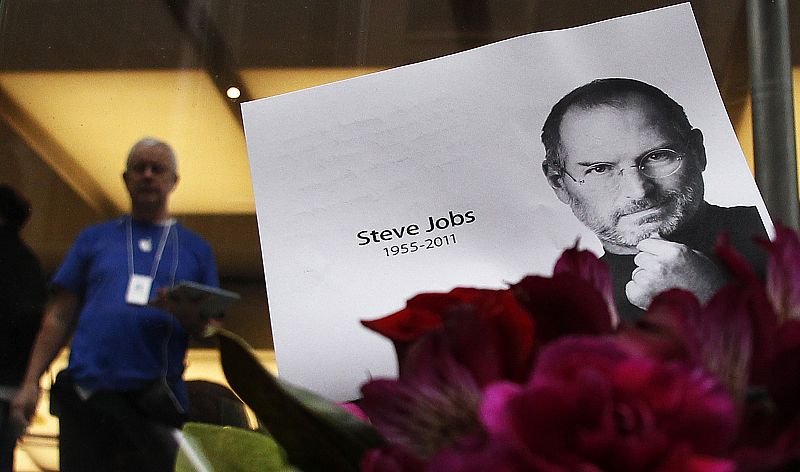 Flowers in memory of Apple co-founder Steve Jobs are seen outside an Apple Store in Central Sydney