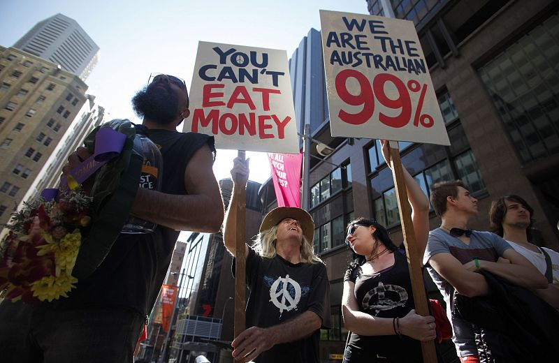 Protesters of the Occupy Sydney movement march in front of the Reserve Bank of Australia in centra Sydney