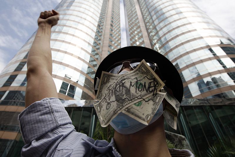 A protester takes part in the "Occupy Central" protest outside the Hong Kong Stock Exchange