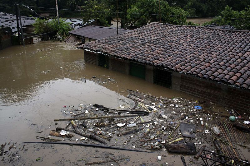 A view of a house flooded by the overflow of a river in La Libertad