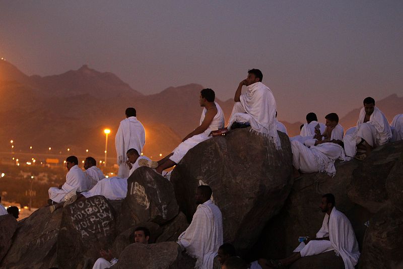 Muslim pilgrims pray on Mount Mercy on the plains of Arafat during the annual haj pilgrimage, outside the holy city of Mecca