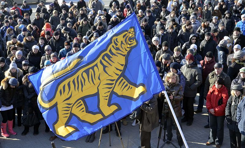 Opposition activists hold a rally to protest against violations at the parliamentary elections, in Russia's far eastern city of Vladivostok