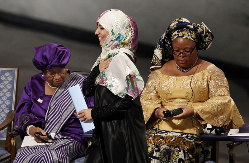 Nobel Peace Prize winner Yemeni human rights activist Karman walks on stage past Liberian peace activist Gbowee and Liberian President Johnson-Sirleaf during the award ceremony in Oslo