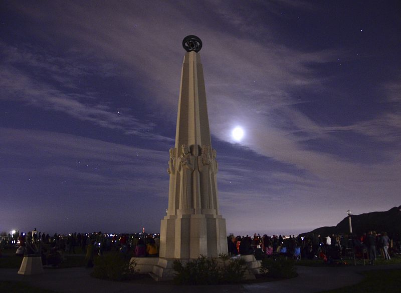 A crowd of more than 600 people gather in the early morning at the Griffith Park Observatory to see the lunar eclipse, in Los Angeles