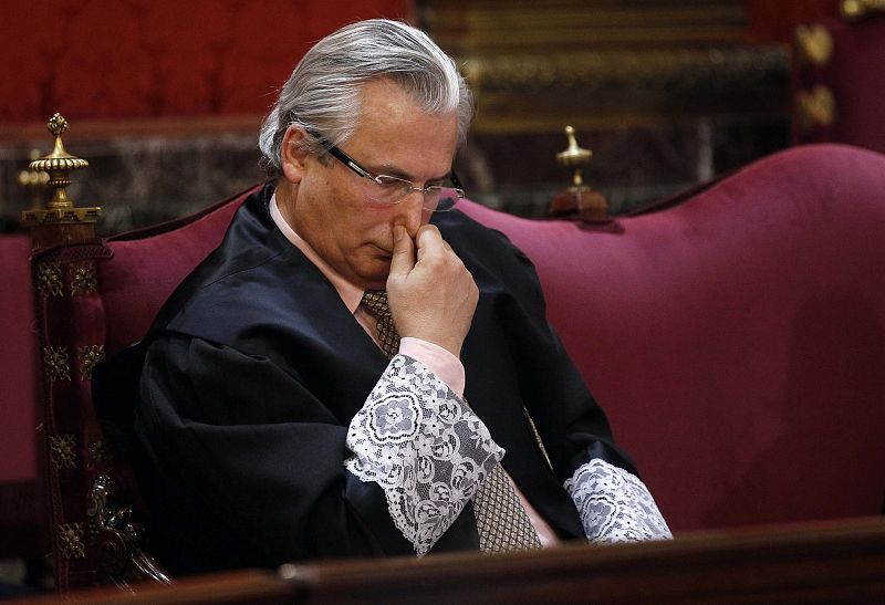 Spanish judge Baltasar Garzon sits  in the dock in the Supreme Court at the start of his trial in Madrid