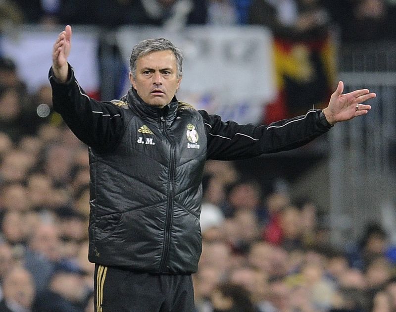 Real Madrid's coach Mourinho gestures during their Spanish King's Cup soccer match against Barcelona in Madrid