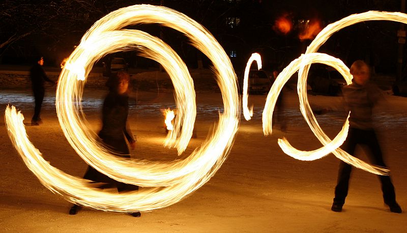 Amateur artists perform a fire show to celebrate the Chinese new year in Russia's Siberian city of Krasnoyarsk