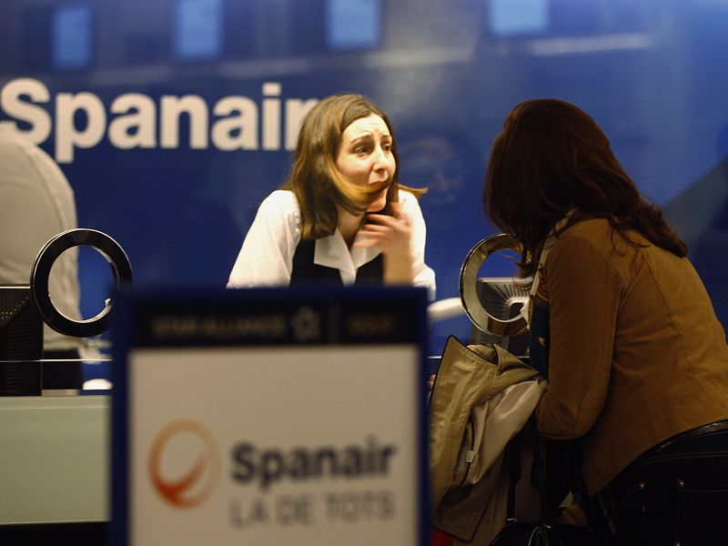 A passenger protests the cancellation of flights in front of Spanair's desk at Barcelona's airport near Barcelona