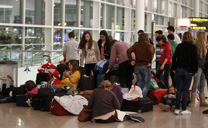 Students who are unable to fly to the island of Majorca after the cancellation of flights, gather in front of Spanair's desk at Barcelona's airport