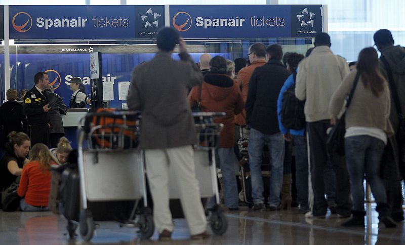 People seek claims at the desk of Spanair at Barcelona's airport