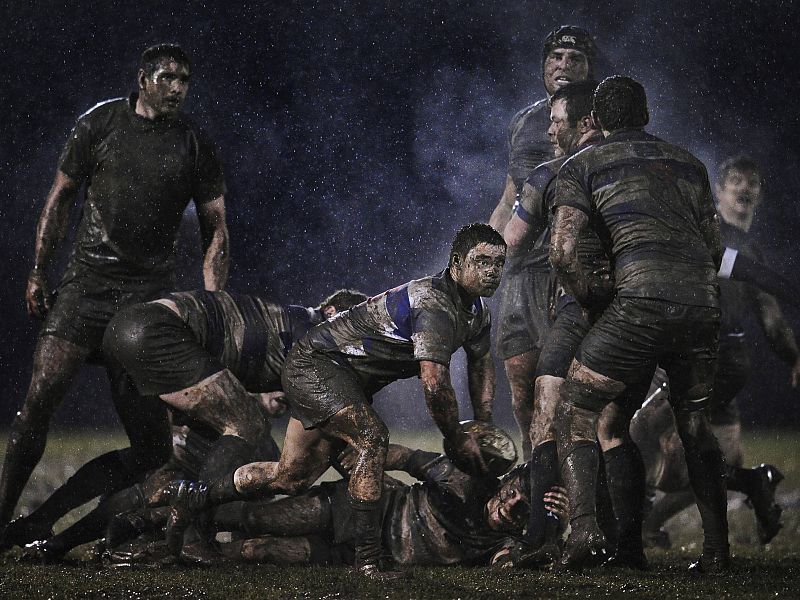 Ray McManus of Ireland has won the second prize Sports Singles with this action picture from a rugby match between Old Belvedere and Blackrock played in heavy rain in Dublin