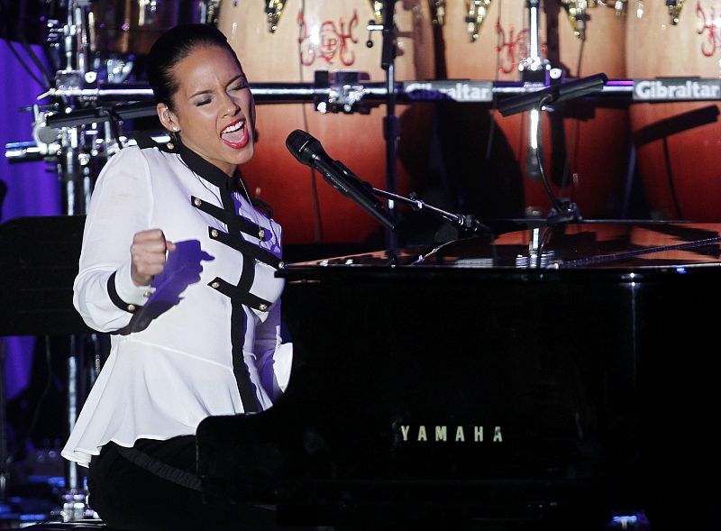 Singer Keys sings a line from a Whitney Houston song as she talks about Houston before performing during 2012 Pre-Grammy Gala & Salute to Industry Icons at Beverly Hilton Hotel