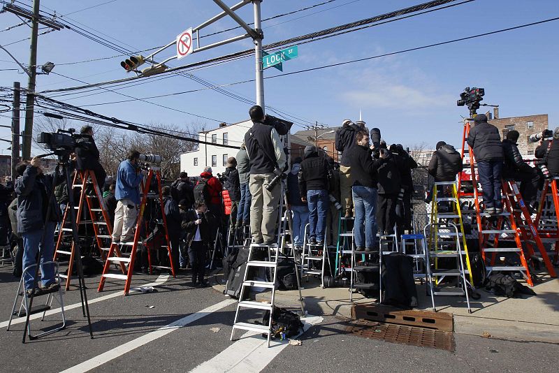 Members of media stand at Sussex Street near New Hope Baptist Church where funeral service for the late singer Houston will take place in Newark