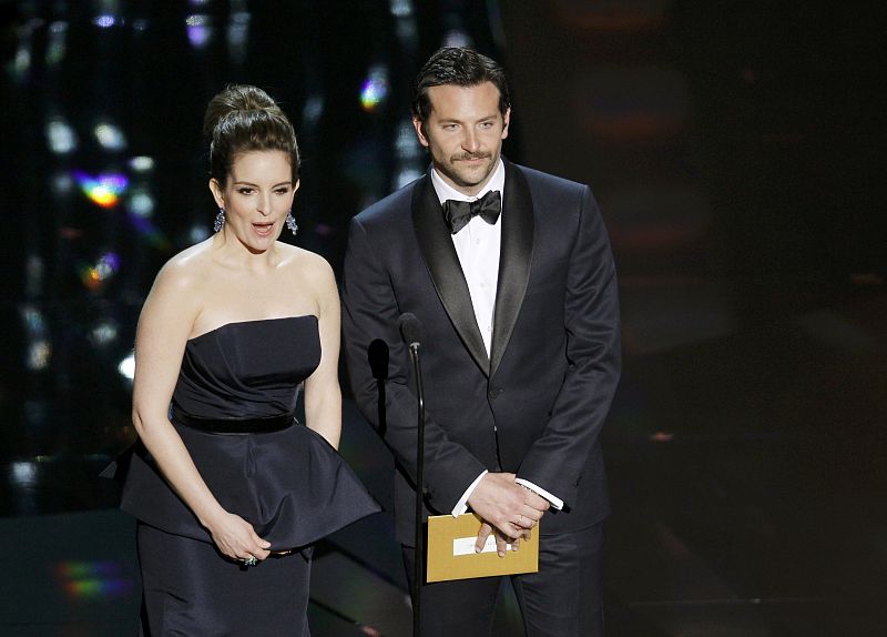 Presenters Fey and Cooper stand on stage at the 84th Academy Awards in Hollywood