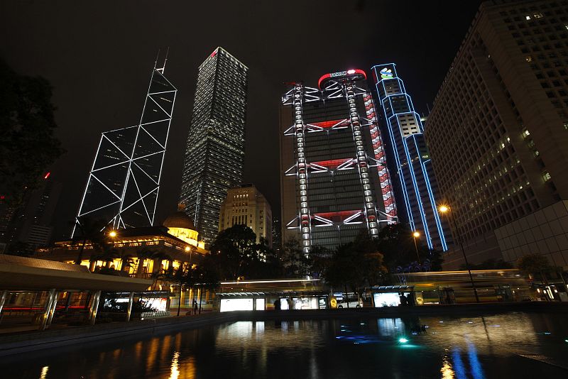 Hong Kong's central financial district's Bank of China Tower, Cheung Kong Centre, HSBC headquarters, Standard Chartered Bank and Legislative Council are pictured lighted up before Earth Hour