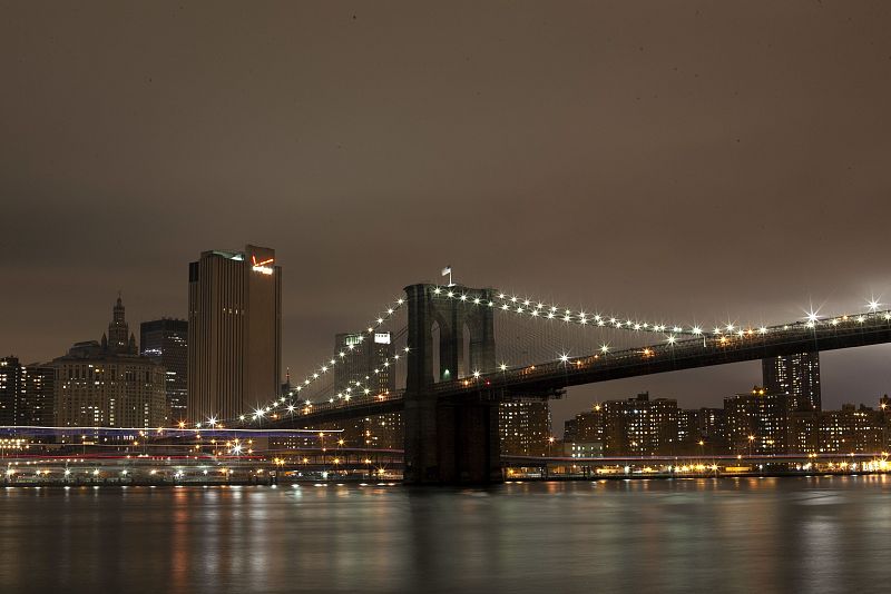 The Brooklyn Bridge is seen before the lights are turned off, in participation with Earth Hour, in New York