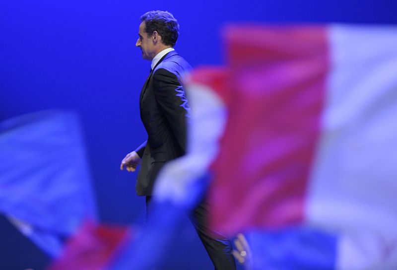 Nicolas Sarkozy, France's incumbent president, reacts after his defeat for re-election in the second round vote of the 2012 French presidential elections as he appears on stage before UMP party supporters at the Mutualite meeting hall in Paris
