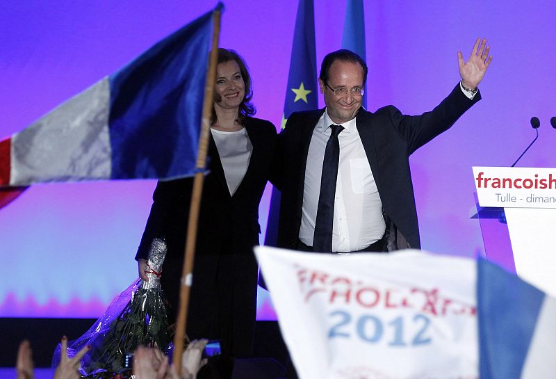 Francois Hollande, Socialist party presidential candidate, celebrates with his companion Valerie Trierweiler after results in the second round vote of the 2012 French presidential elections in Tulle