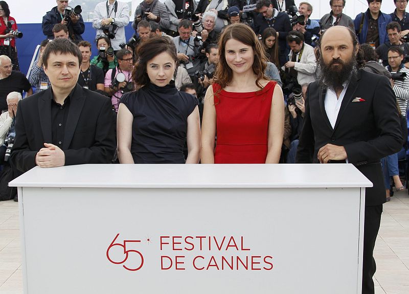 Cast members Stratan and Flutur attend a photocall for the film Dupa Dealuri by director Mungiu in competition at the 65th Cannes Film Festival